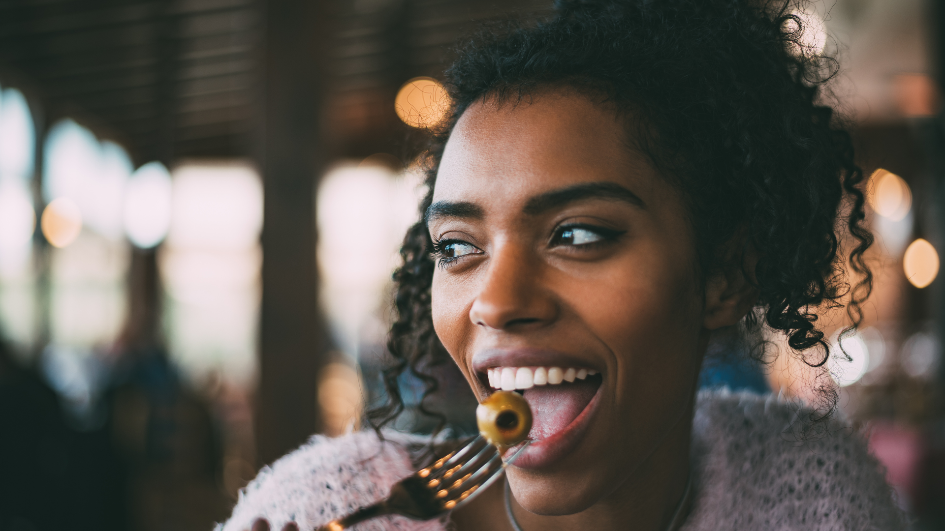 woman eating image Black Owned Restaurants You Should Support in Atlanta, Georgia
