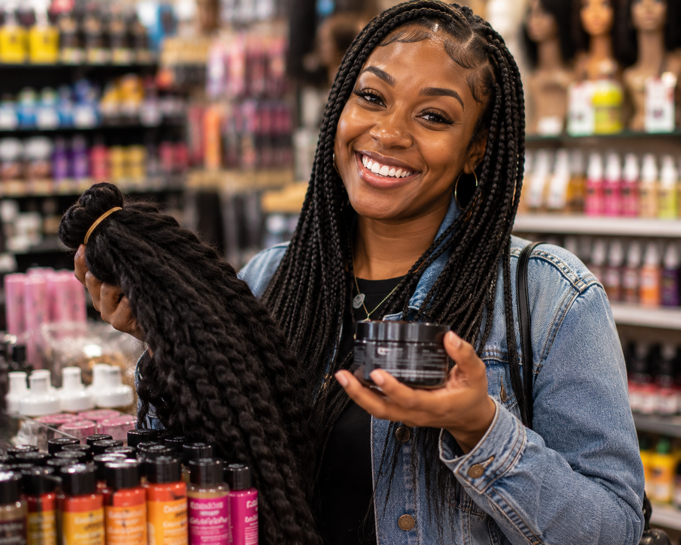 Black shopper buying braiding hair and edge control at a Black-owned beauty supply in Chicago