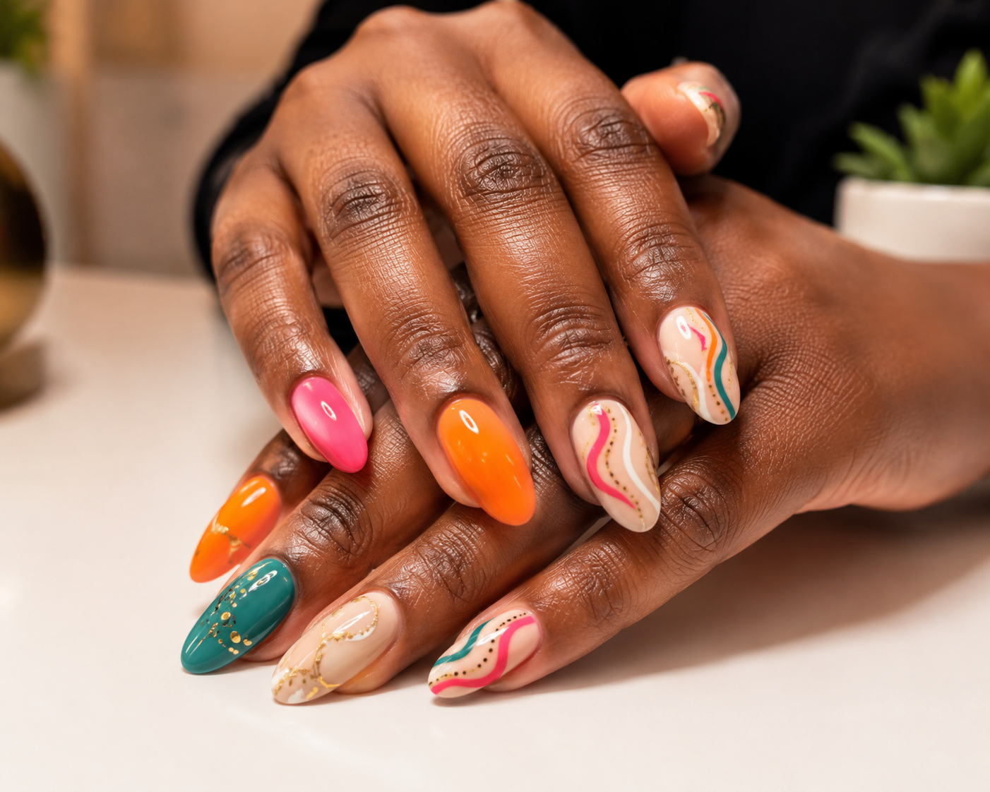 Detailed nail art on a Black woman's hands at a Brooklyn black-owned nail salon