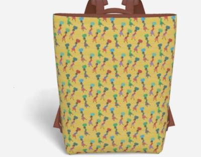 An elegant culture focused vegan leather backpack featuring a vibrant Afrocentric pattern